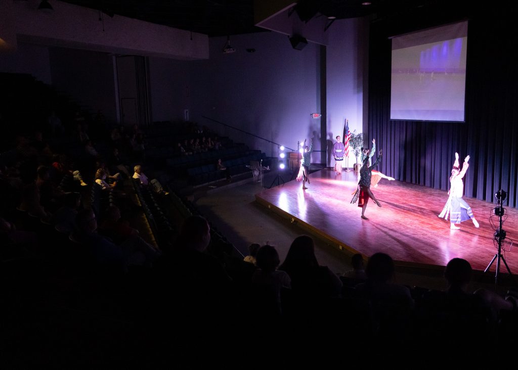 Pictured: A crowd of students, faculty, staff, and more, watch the Osage ballet “Wahzhazhe” on Aug. 15 in the Jeff Johnston Fine Arts Auditorium.