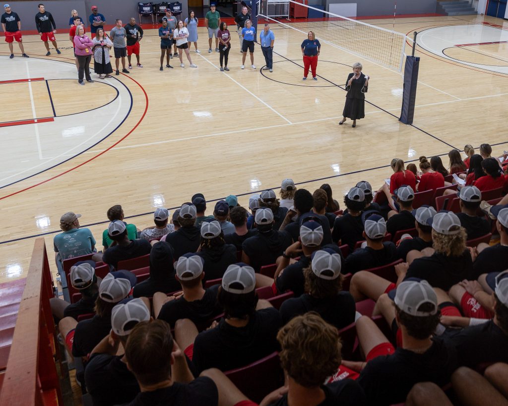Pictured: SSC President Lana Reynolds speaks with over 170 students at an athletic orientation held in the Raymond Harber Field House on Aug. 15. 