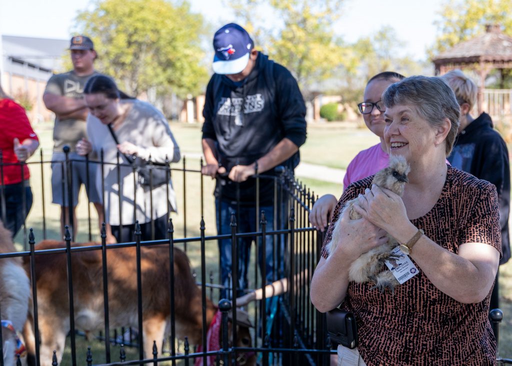 Pictured, Information Technology Technician Teresa Norman holds a chicken at the petting zoo on SSC’s campus on Sept. 26.