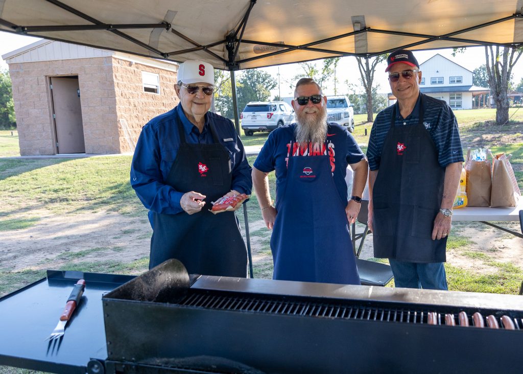 Pictured (left to right) SSC Educational Foundation Trustee Jim Hardin, SSC Vice President for Student Affairs Dr. Bill Knowles and Foundation Trustee Doug Humphreys prepare hot dogs and brats for participants at the event.