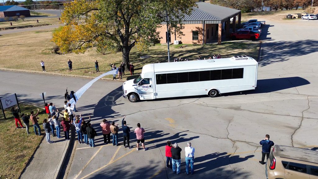 Pictured, SSC students, employees, community supporters, family and friends line the sidewalks and hold a banner for the teams bust to break through as they head to the NJCAA Division I National Tournament.