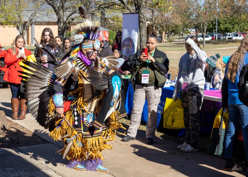 Pictured, SSC Alumnus and Mr. Indigenous OU Asa Samuels performs fancy dancing.