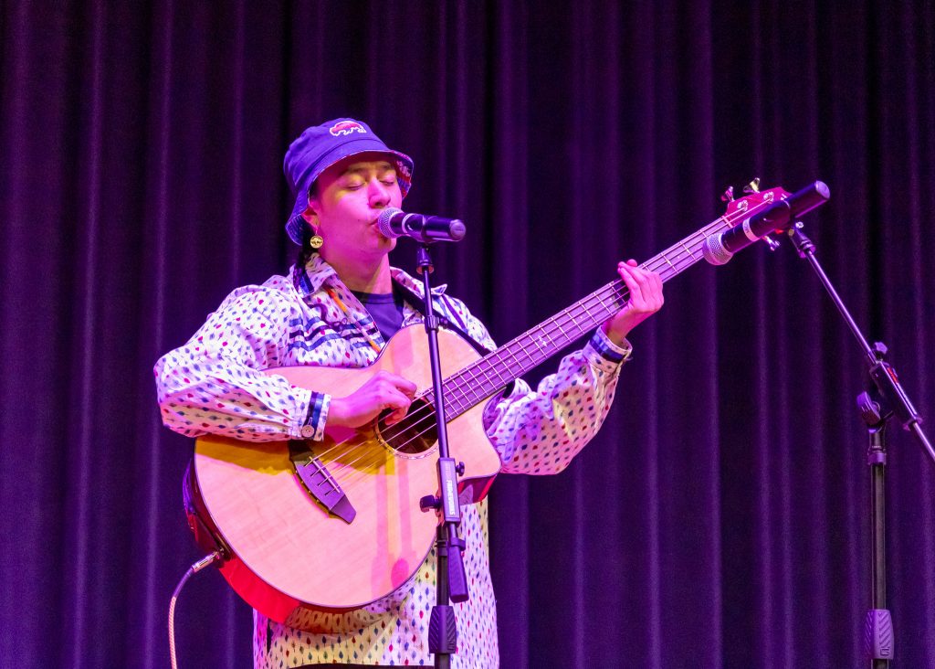 Pictured is Sicangu Lakota rapper Frank Waln performing in the Jeff Johnston Auditorium.