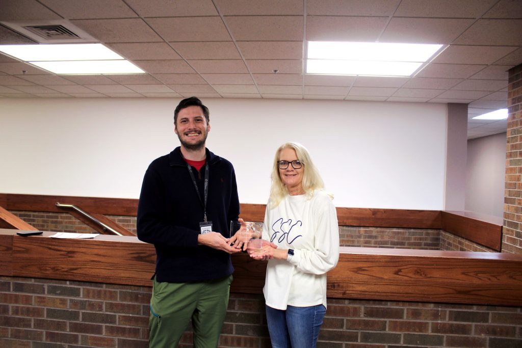 Pictured, Community Drug Overdose Prevention Coordinator Zane Winters (left) presents the Certified Healthy Campus award to SSC Wellness Committee Chair Mechell Downey (right) on Dec. 1.