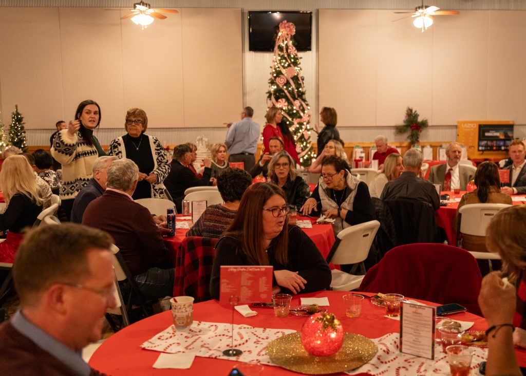 Pictured, attendees of the Seminole State College Educational Foundation's annual Holiday Reception fundraising event enjoy food and conversation.