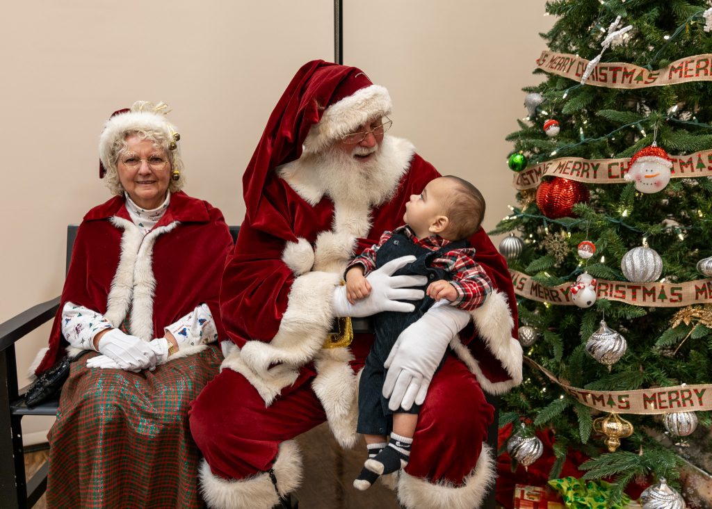 Children share their Christmas wishes and pose for pictures with Santa and Mrs. Claus, including Creed Kemp (pictured).