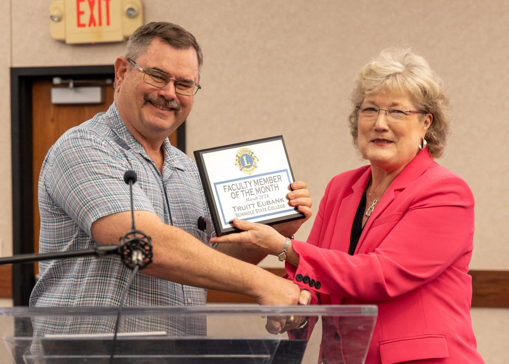 The Seminole Chamber of Commerce recognized Assistant Professor of Life Sciences Truitt Eubank (left) as the Faculty Member of the Month at their Forum on March 14. SSC President Lana Reynolds (right) presented the award.