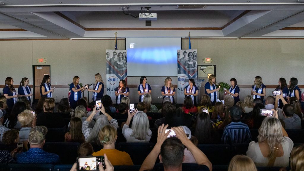 In this photo, graduating nursing students participate in the candle lighting ceremony during the 2025 SSC Nursing Pinning.