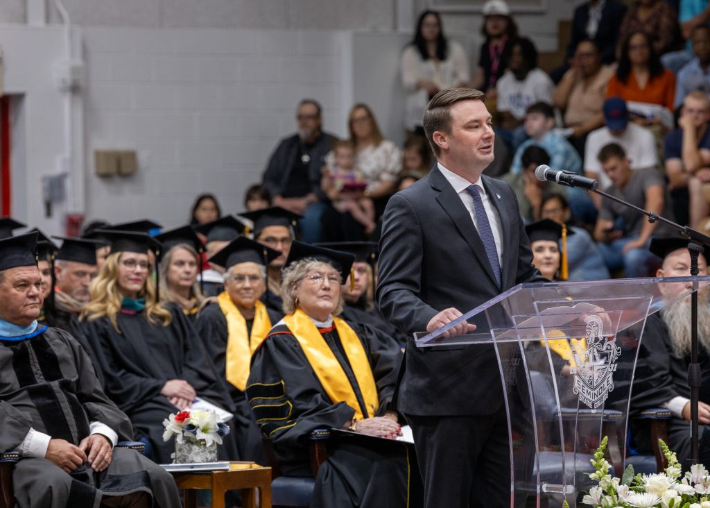 Pictured speaking from the podium during SSC's 92nd Commencement is Speaker of the Oklahoma House of Representatives Kyle Hilbert.