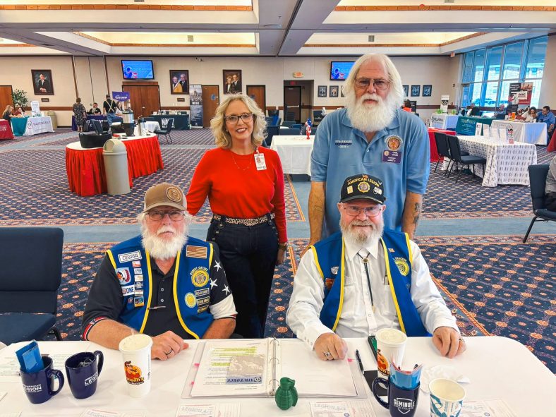 In this photo, Pictured (left to right): American Legion Post 204 Vice Commander Robert Gatzke, SSC VA School Certifying Officer Stacey Foster, Post 204 Commander Carl Odom and Post 204 member Harris Thacker pose for a photo at the event. The American Legion donated 5,000 American flags that were planted across campus in recognition of the event and the Veteran’s Day holiday.