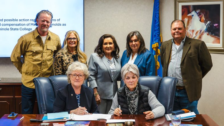 In this photo, Seminole State College Board of Regents members gather around SSC President Lana Reynolds for a group photo. Pictured (seated, l-r): President Reynolds, Chair Marci Donaho; (standing, l-r) Regents Ryan Franklin, Robyn Ready, Mona Adkisson, Teresa Burnett and Curtis Morgan