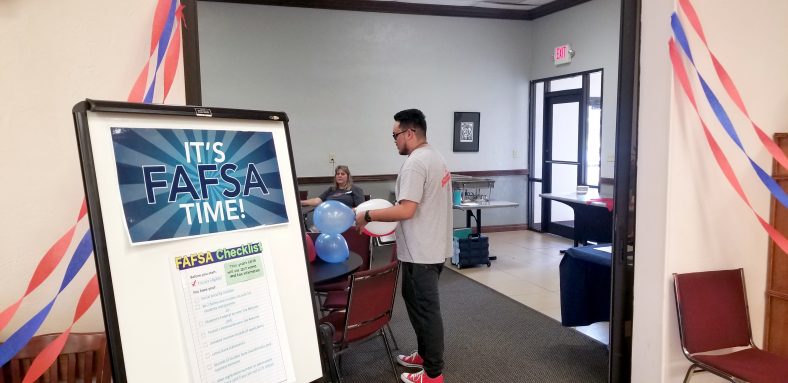 Student with balloons