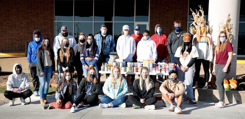 Leadership class stands with their donations.