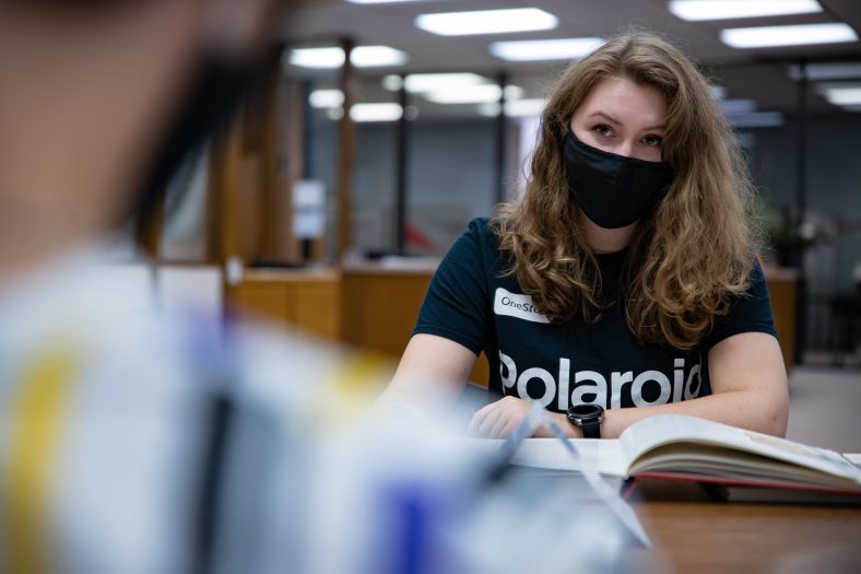 Two students study for class.