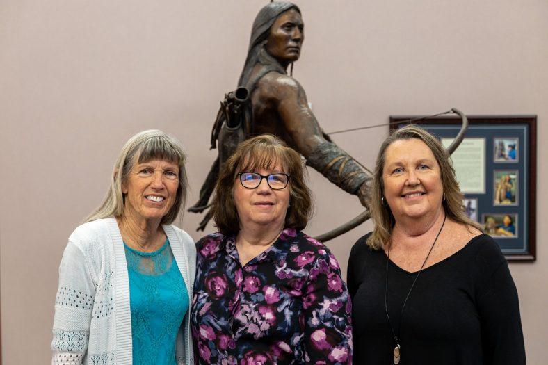 Former SSC employees Susan Walker (left), Brenda Cates (center), and Carol Hartman (right) pose outside of the College’s Board of Regents meeting, where they were granted emeritus status on March 24.