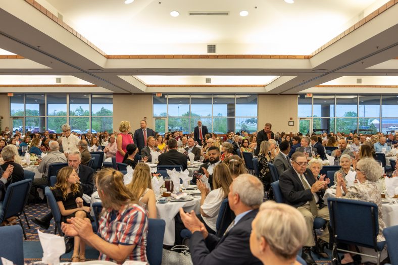 SSC Regents stand and are recognized by the crowd at the Spring Banquet.