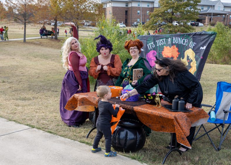 Pictured is one of the many sponsored tables set up to hand out candy during SSC's Trick or treat trail. This table is being ran by ssc employees dressed as the three witches from the movie, Hocus Pocus.
