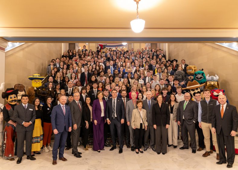 Pictured are hundreds of students from different colleges and universities across the state of Oklahoma posing with Govenor Stitt and other Oklahoma legislators at the State Capitol for a photo.