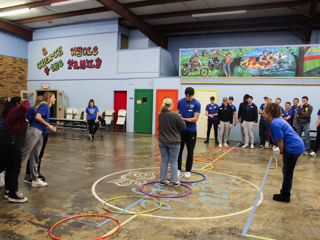Pictured, Charity Hair, Seminole, and Holden Bradford, Oklahoma City, face off in an enthusiastic rock, paper, scissors battle royale while their teams cheer them on waiting for their turn.