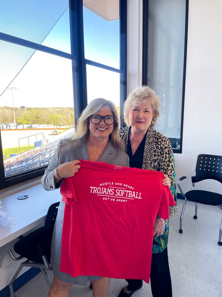 Pictured is Dr. Tina Floyd (left), the owner of the professional softball team the OKC Spark as she is presented with an SSC softball shirt by SSC President Lana Reynolds (right)