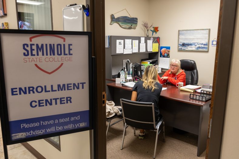 Pictured is Academic Advisor Cindy Nolen as she helps a student enroll at SSC in the Walkingstick Student Services Center.