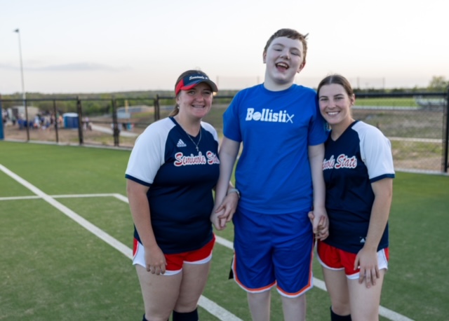 In this photo Draven McDowell of Seminole (center) celebrates a base hit with SSC softball players Josalyn Faulkner of Oklahoma City (left) and Kaylee Madden of Wayne (right).