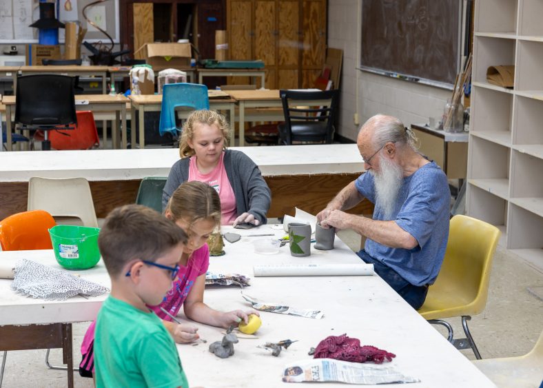 Pictured are children participating in the 2023 Kids on Campus Summer Camp art and ceramics class.