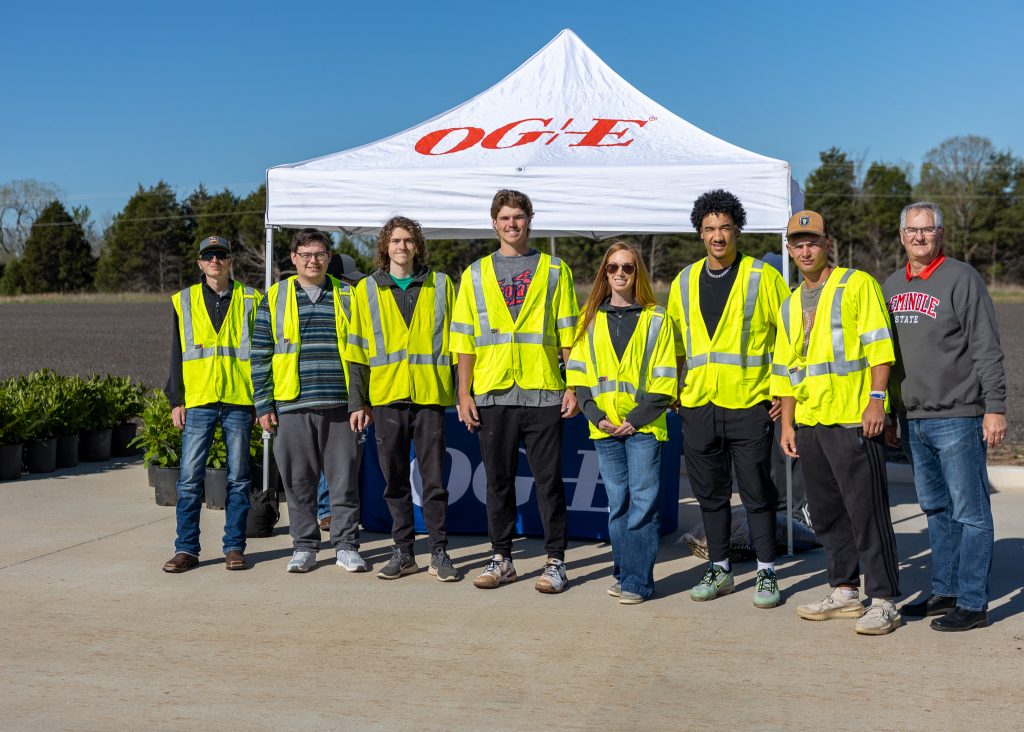 Pictured (left to right): Gage Fiegener, Cord Bender, Jakin Teape, Luke George, Assistant Professor of Agriculture Wendy Rich, Anthony Smith, Bill McCarter and Director of the SSC Rural Business and Resources Center Danny Morgan pose for a group photo.