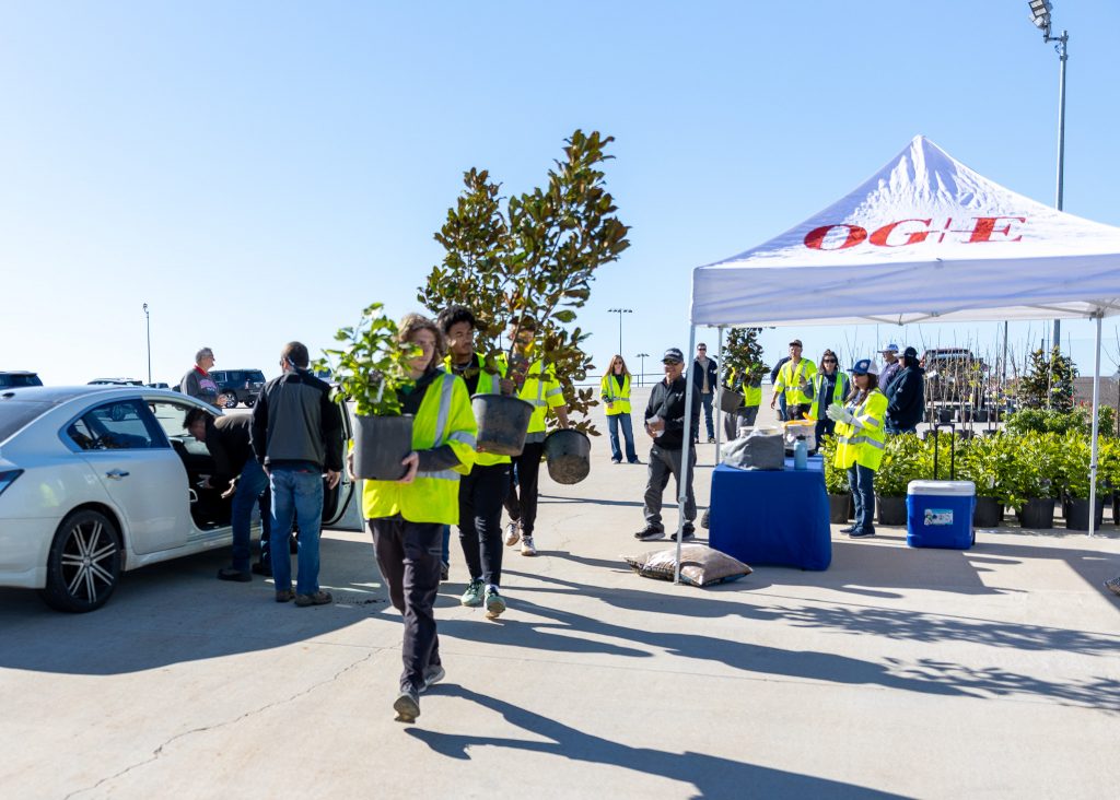 Pictured are SSC students and OG&E employees loading up trees for community members as a part of the company’s environmental stewardship program.