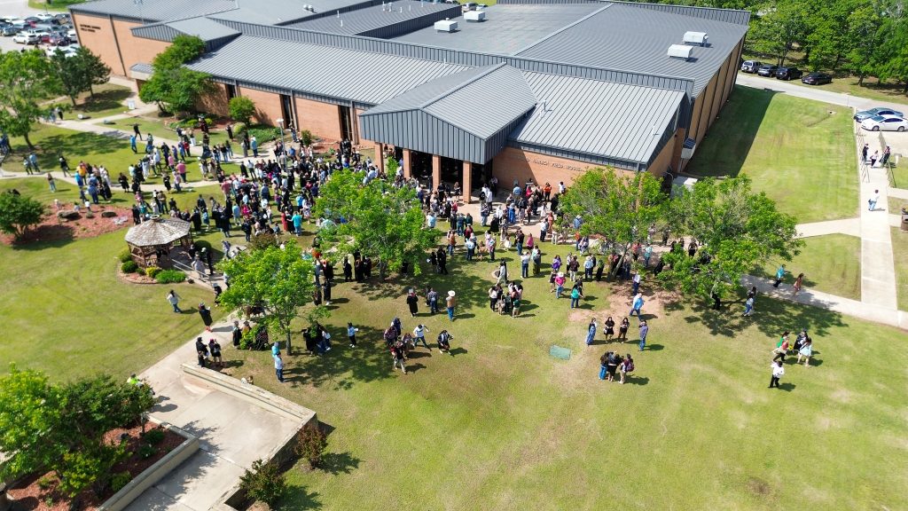This photo shows an ariel view of Graduates and their families gathering in Cook Commons on the Seminole State College campus following the commencement.