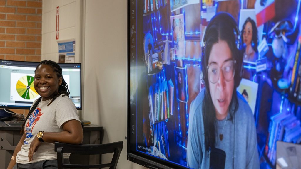 In this photo, NASNTI Computer Science Specialist Alecia Bailey (left) and NASNTI Esports Expert Angelica Lozano-Romines (right) engage SSC Upward Bound students during “Hack-a-thon: Design a Game for Good” on the evening of June 16 in Tanner Hall.