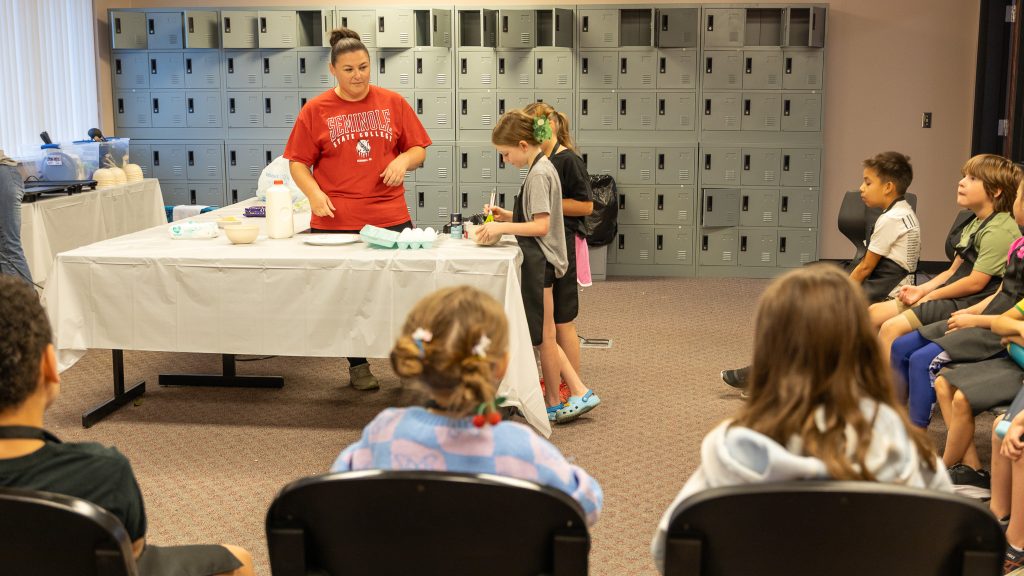 In this photo, SSC Business and Industry Coordinator Talina Lee teaches young chefs during the Kitchen Confidence for Kids class.
