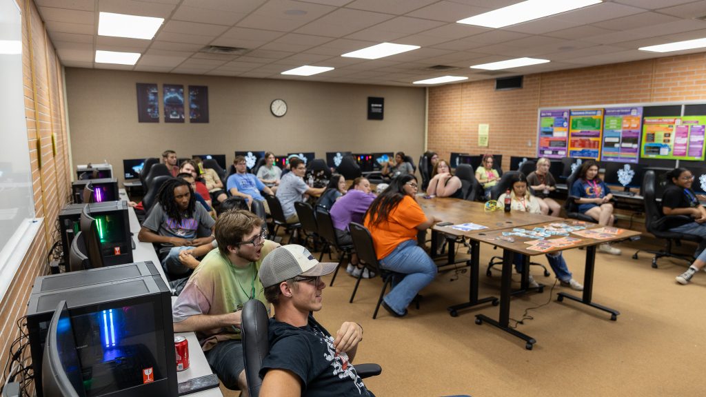In this photo, a classroom full of Upward Bound students is shown as they participate in “Hack-a-thon: Design a Game for Good.”