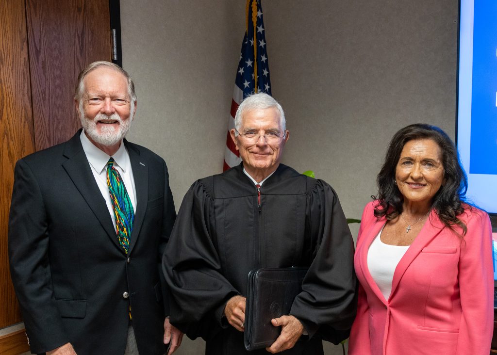 In this photo, Barry Tims (left) and Mona Adkisson (right) pose for a photo after being sworn in at the July 17 meeting of the SSC Board of Regents. Former District Judge George Butner (center) administered the Oath of Office.