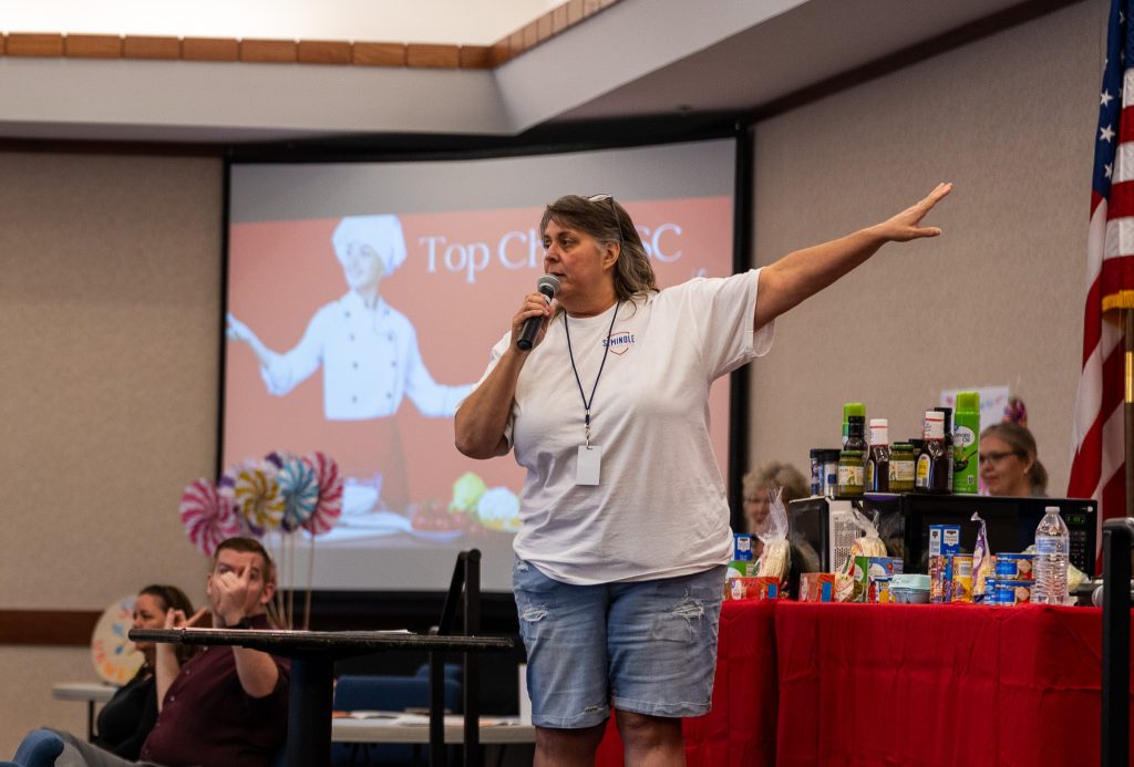 In this photo, Seminole State College Student Support Services and STEM SSS Director Janna Wilson-Byrd speaks before a crowd at fall 2024’s new student orientation event.