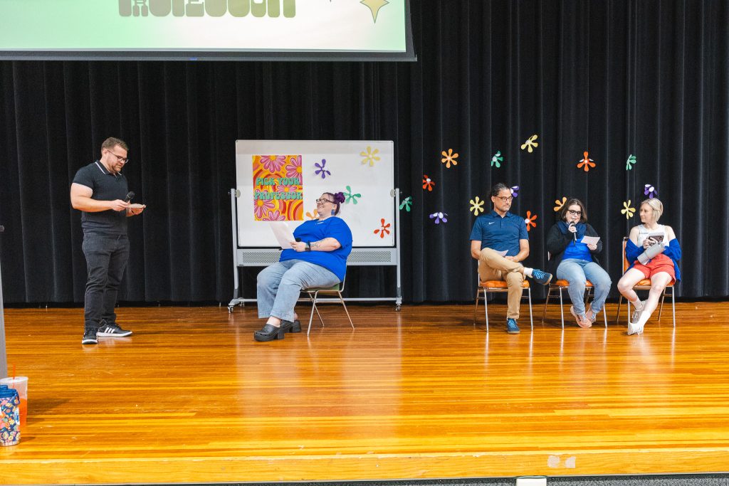 In this photo, Seminole State College faculty and staff are shown on stage performing “Pick Your Professor,” a game-show skit where a student interviews professors to find the best fit for their learning style.