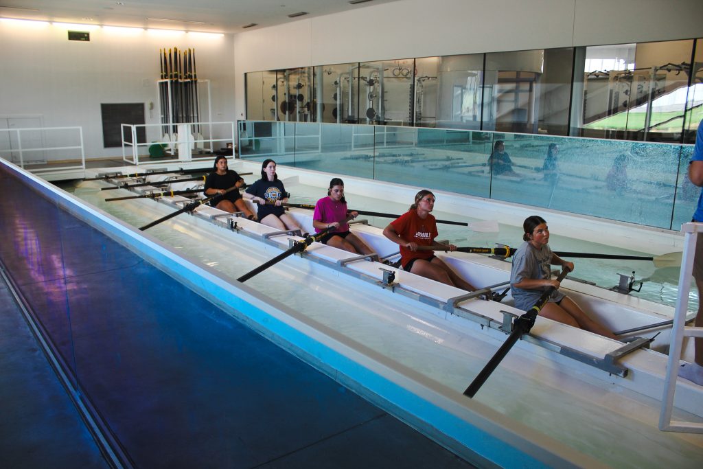 In this photo, PLC students are shown testing their rhythm and endurance in Riversport’s Boathouse Experience, an indoor rowing simulator.
