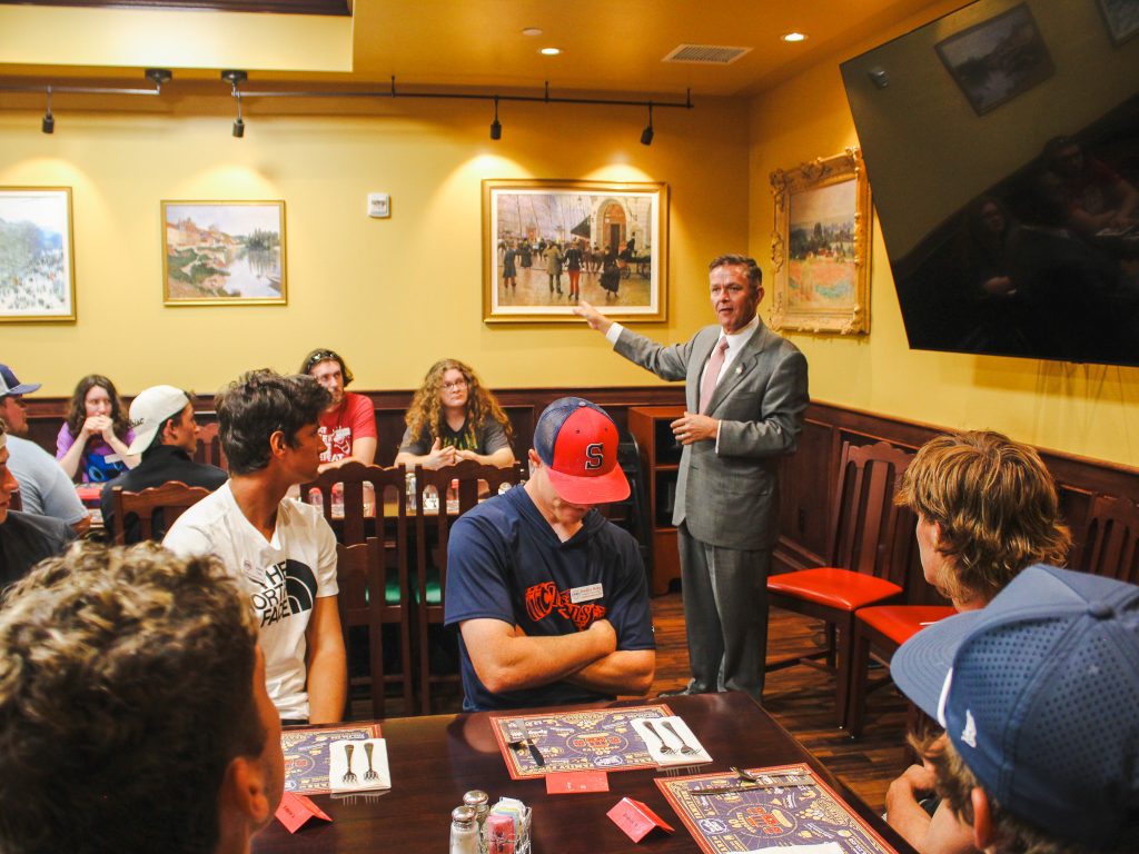 In this photo, State Sen. Mark Mann (D-District 46), who represents Del City and parts of Oklahoma City, speaks with students before dinner at The Old Spaghetti Factory.