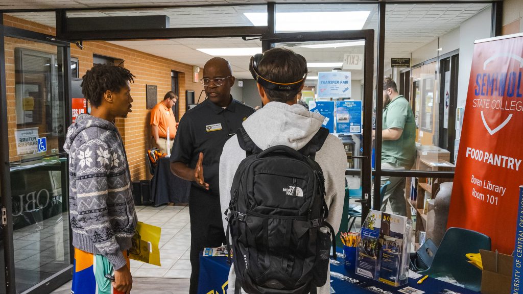 In this photo, two Seminole State College students are pictured speaking with a representative from the University of Central Oklahoma at the Transfer Fair on Oct. 1.