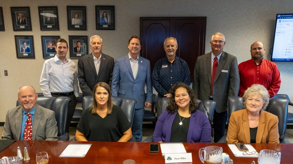 Community leaders pose for a photo in the Enoch Kelly Haney Center Board Room.