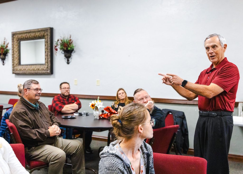 Dr. Streight address attendees at retirement reception.