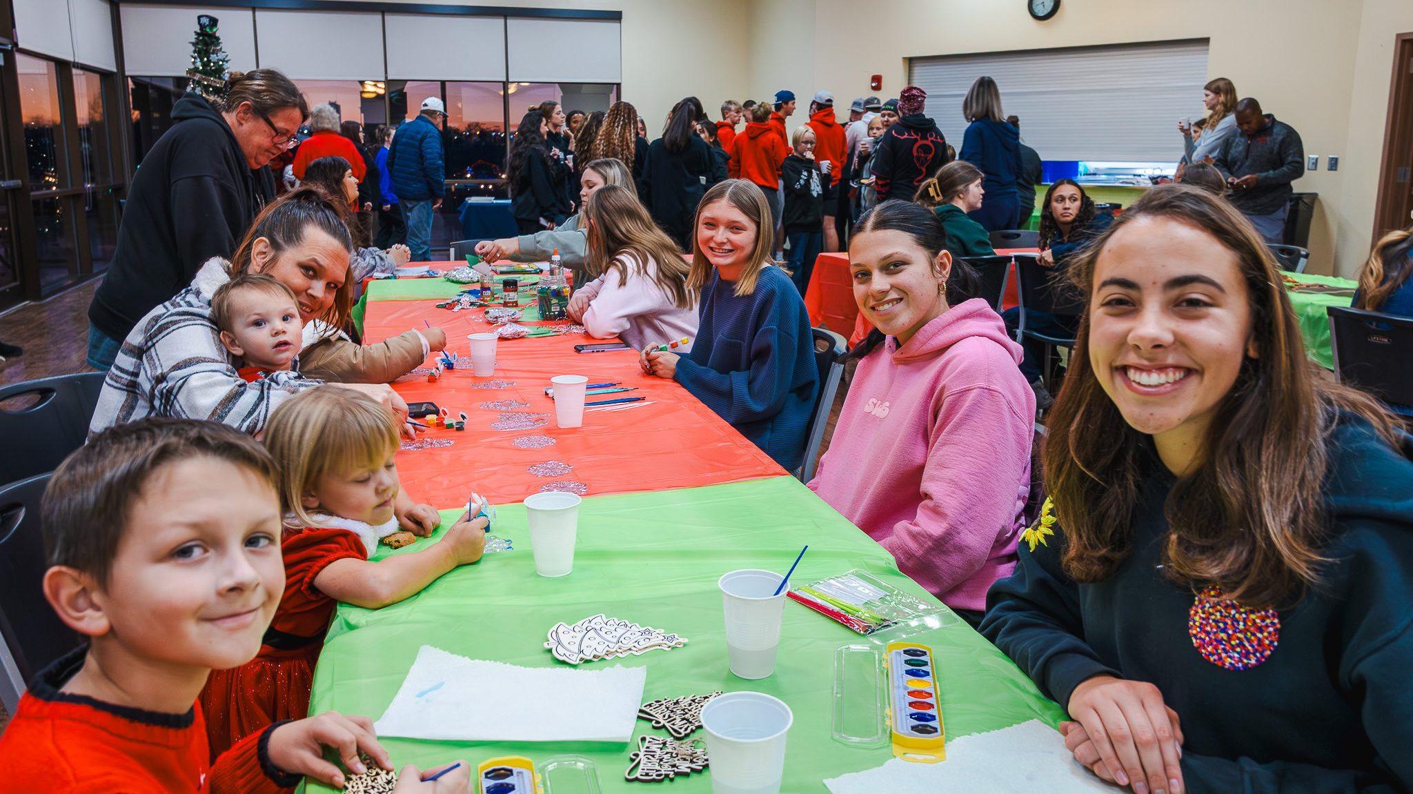 In this photo, SSC student-athletes help children with holiday crafts during Seminole State College’s Night at the Lights event at the Reynolds Wellness Center on Dec. 8.
