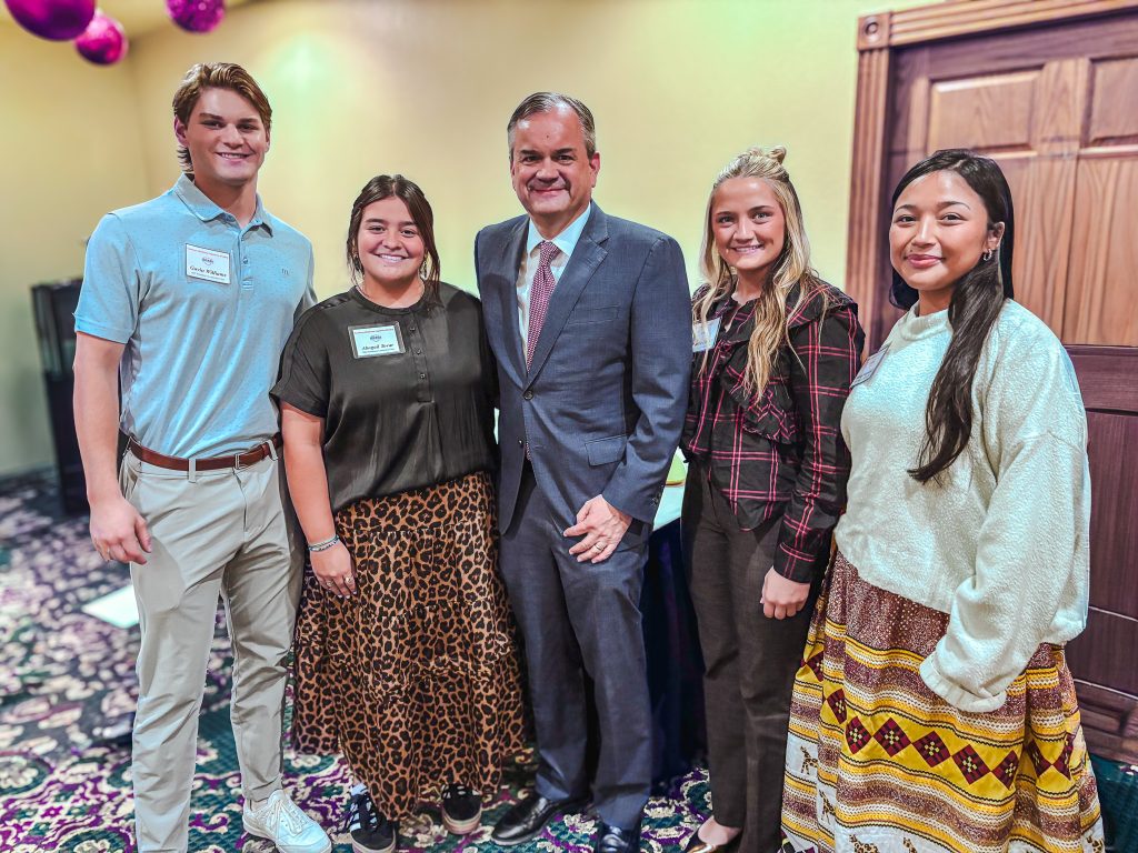 Pictured with Chancellor Burrage (center) in a group photo are PLC students (left to right): Gavin Williams of Jones; Haddie Lindley of Horntown, Abigail Tovar of Wilburton and Alivia Wapskineh of McLoud.
