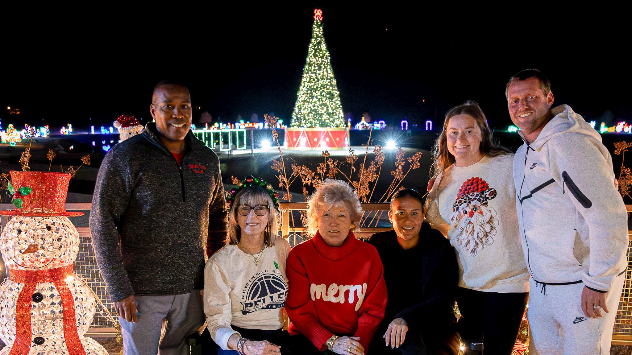 In this photo, SSC coaches and President Lana Reynolds gather for a photo in front of the Snowman Wonderland light display during Night at the Lights on Dec. 8. Pictured from left are Baseball Head Coach Mack Chambers, Women’s Basketball Head Coach Rita Story-Schell, President Reynolds, Softball Head Coach Amber Flores, Women’s Volleyball Head Coach Hannah Kemp and Women’s Soccer Head Coach Dan Hill.
