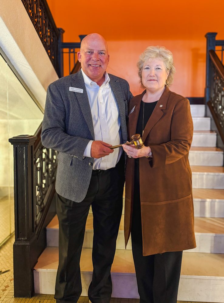 BancFirst President and CEO Darryl Schmidt (left) passes the gavel to Seminole State College President Lana Reynolds (right) as Reynolds assumes the role of 2026 Oklahoma Academy chair during the Academy’s annual business meeting Jan. 16 in Oklahoma City.