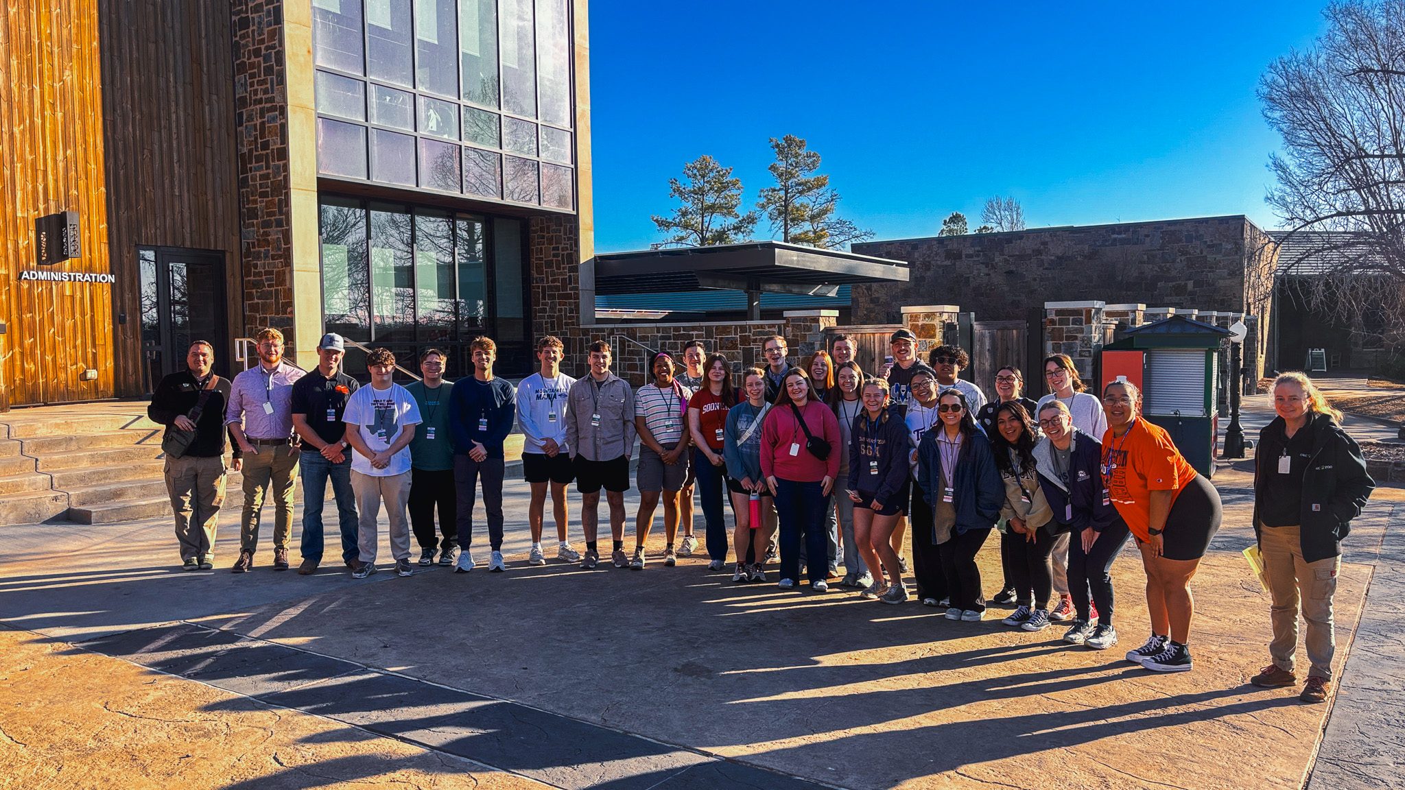 In this photo, Participants in the 2026 George and Donna Nigh Leadership Academy pose for a group photo after volunteering at the Oklahoma City Zoo as part of a service project during the four-day leadership program.
