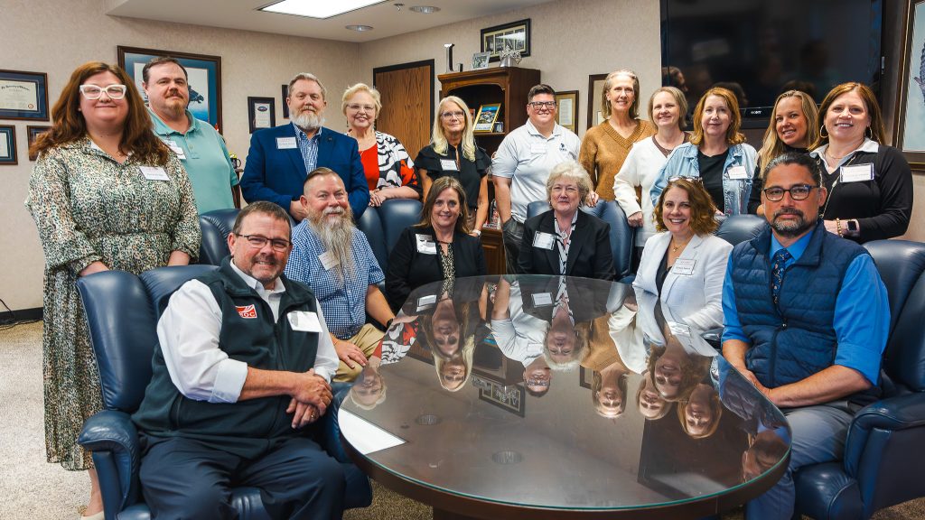 In this photo, pictured standing (left to right) are: Harli Dodge, NOC Director of Recruitment; Marc Hunter, SSC Director of Information Technology and Chief Information Security Officer; Dr. Mash Howard, NOC Stillwater VP; Kelli McBride, SSC Language Arts and Humanities Division Chair; Mechell Downey, SSC Director of Board Relations and Administrative Operations; Dr. Deanna Miles, SSC Accreditation Coordinator; Julie Huster Haney, NOC Academic Affairs Assistant; Dr. Kathleen Swain, NOC Director of First-Year Experience; Dr. Kathleen Otto, NOC Institutional Research; Emily Carpenter, SSC STEM Division Chair; and Cara Beth Johnson, NOX Business Faculty. Seated (left to right) are: Jeremy Hise, NOC Enid Vice President; Dr. Bill Knowles, SSC VP for Academic and Student Affairs; Dr. Shelly Mencacci, NOC Vice President for Academic Affairs; Lana Reynolds, SSC President; Jessica Isaacs, SSC Dean of Instruction; and Brad Schatzel, SSC Assistant Professor of Business and Education.