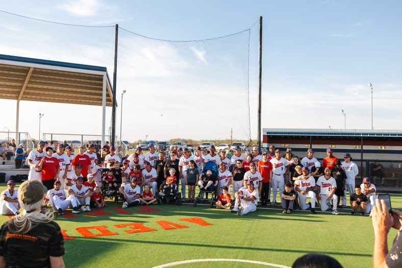 Members of the Seminole State College baseball team pose with players from A League of Their Own following the league’s home opener March 30 at the Avedis Foundation Adaptive Field.