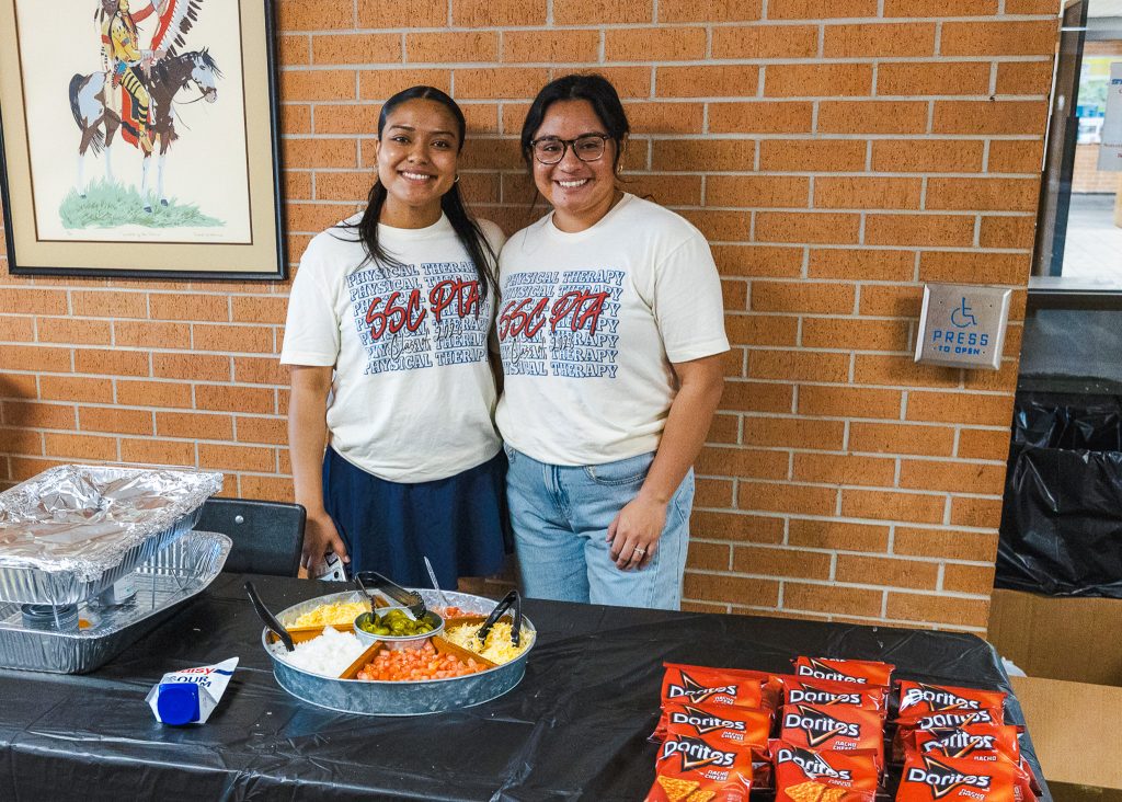 In this photo, SSC PTA students Diana Baiz, left, and Lacy Howell, right, both of Shawnee, sell walking tacos during a campus fundraiser on March 25.