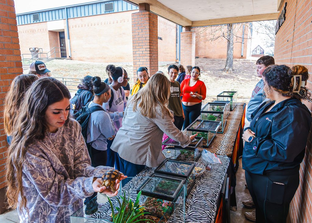In this photo, SSC students are shown interacting with various exotic animals with the animals, under the supervision of Extreme Animals staff.